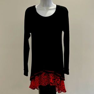 Cute top with high low detail around bottom.